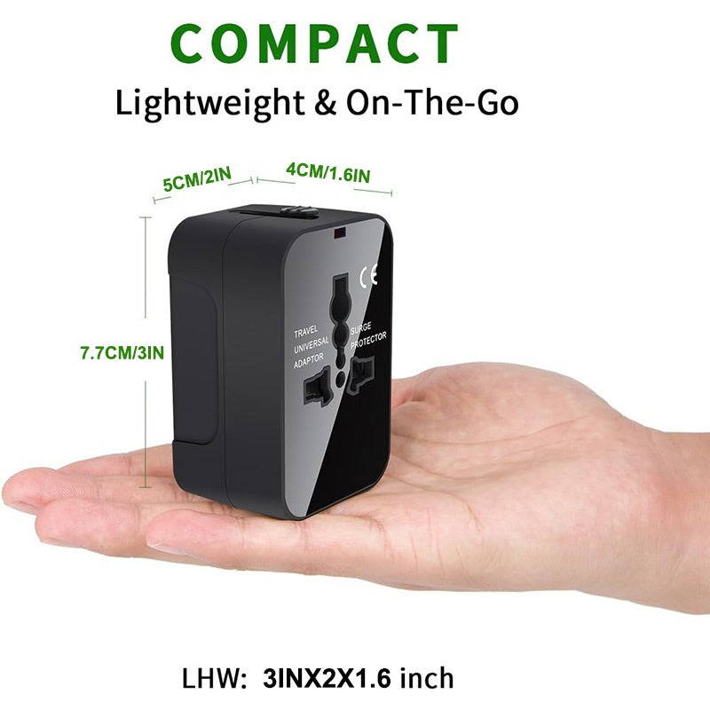 Compact travel adapter held in a hand with dimensions displayed