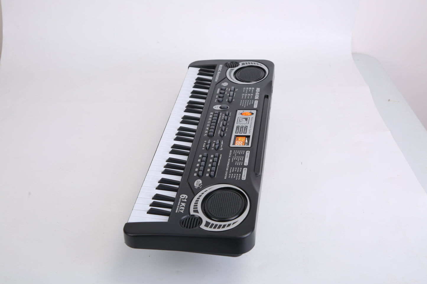 Small electronic keyboard on a white surface