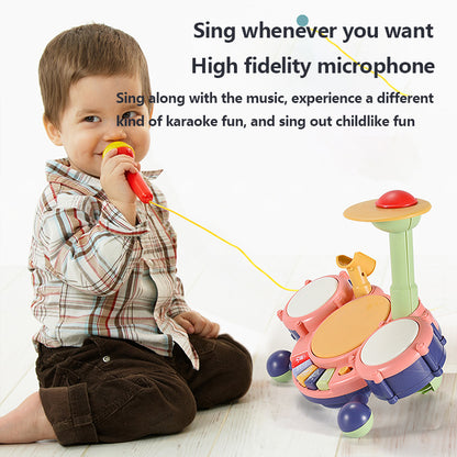 Child playing with a toy microphone and drum set on a white background