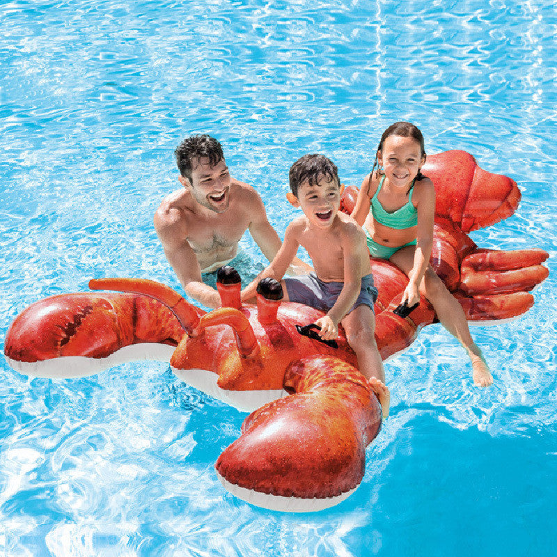 A family with two children and an adult are enjoying a pool with an inflatable water toy designed to look like a red lobster. The toy is inflated and providing fun and stability in the water.