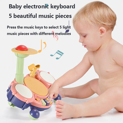 Child playing with a baby electronic keyboard on a white background