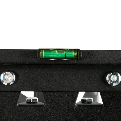 Black metal bracket with a green laser level on a white background