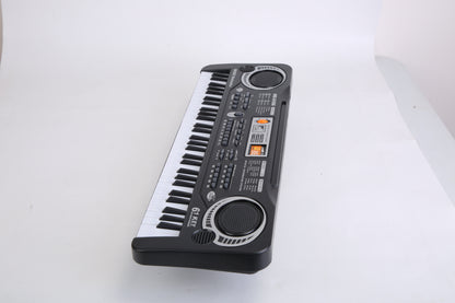 Small electronic keyboard on a white surface